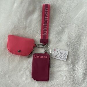 lululemon Pink and Red dual pouch wristlets set